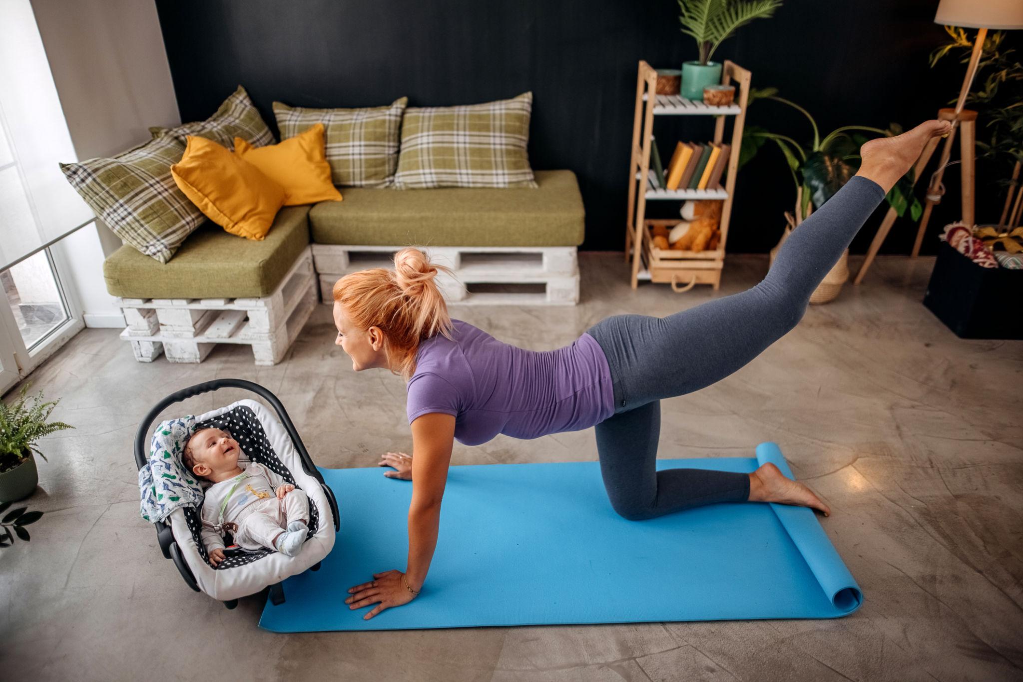 Busy mom doing a 10-minute home workout in living room with no equipment